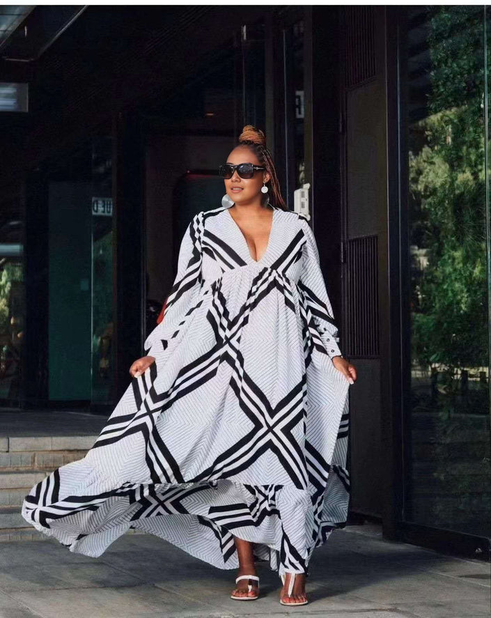 Geometric maxi dress with deep V neckline, black-and-white chevron stripe pattern