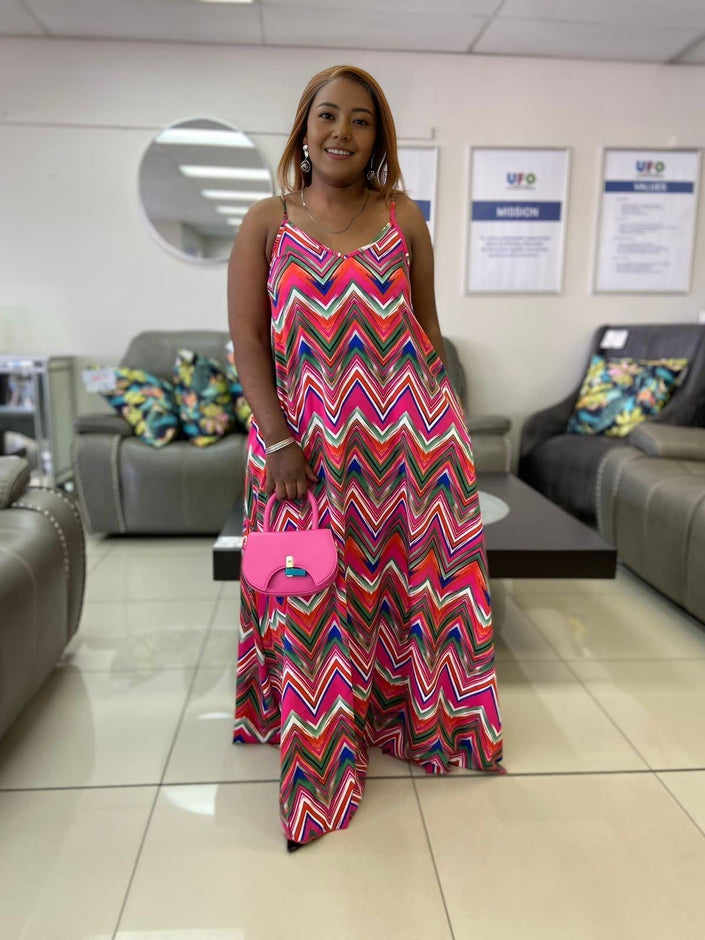 Chevron print maxi dress, sleeveless V-neck with pink, teal, and purple zigzag pattern