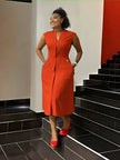 Orange-red sleeveless midi dress with V-neck placket, waist buttons, side pockets