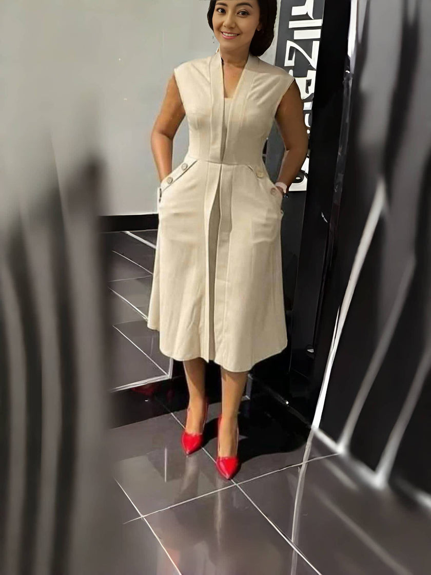 Beige sleeveless midi dress with V-neck seam and waist button accents