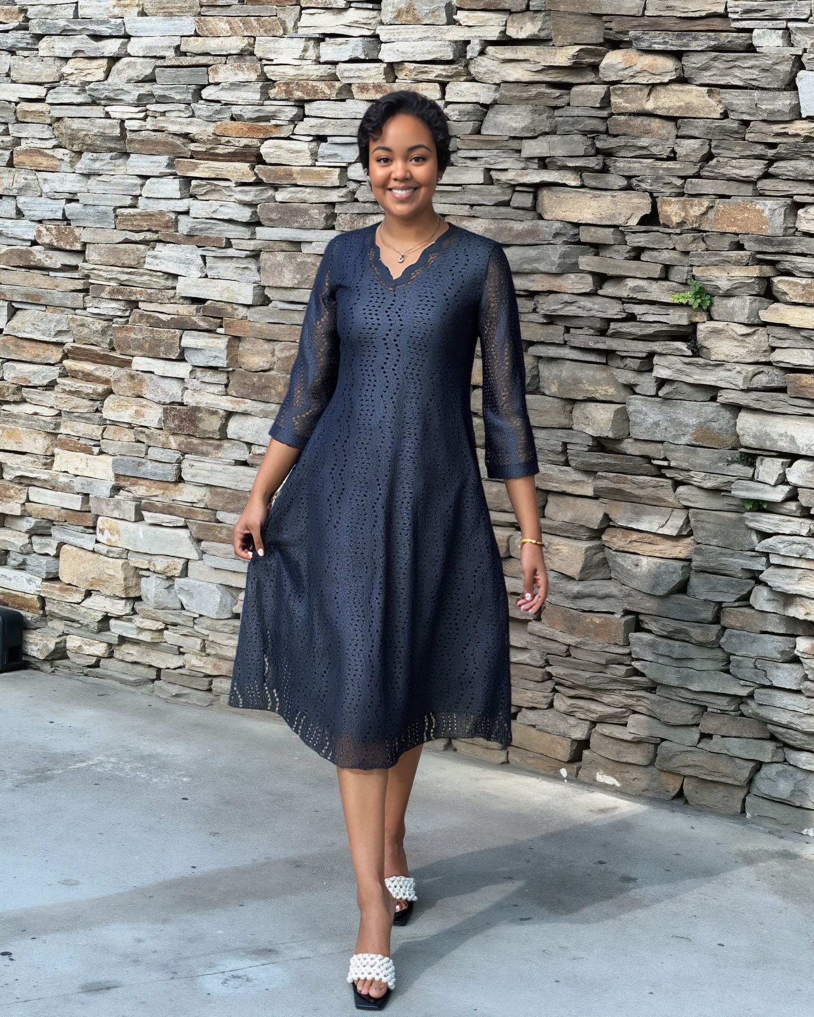 Navy eyelet midi dress with scalloped V neckline, 3/4 sleeves and flared skirt