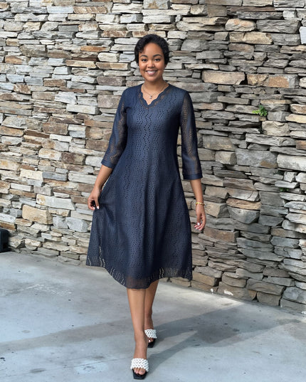 Navy eyelet midi dress with scalloped V neckline, 3/4 sleeves and flared skirt