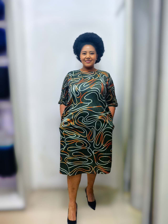 Plus size wavy print midi dress, dark base with multicolor swirls, 3/4 sleeves