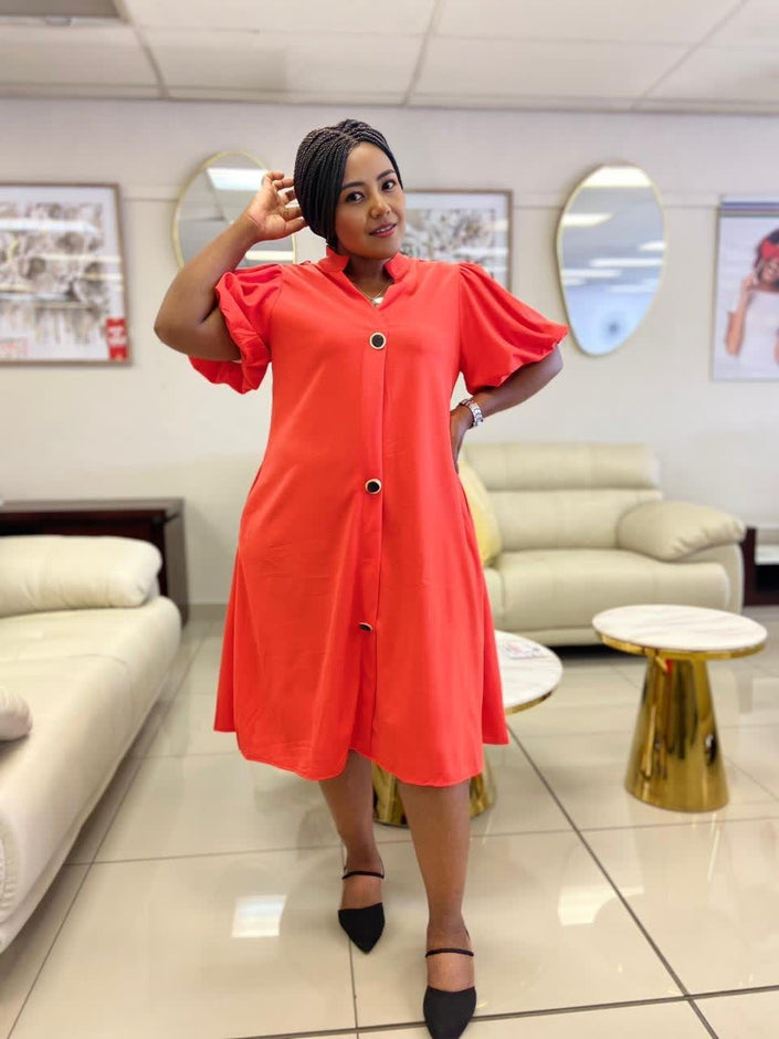 Orange-red puff-sleeve midi button dress with loose fit and front buttons.