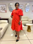 Orange-red puff-sleeve button midi dress, loose fit, round neckline, front buttons.