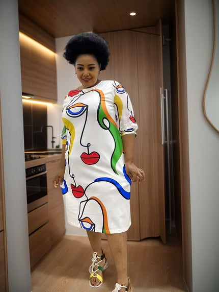 Plus size abstract printed midi dress with long sleeves, white base and colorful graphics