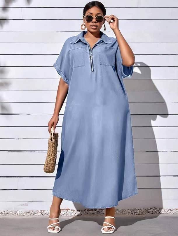 Light-blue plus size shirt dress with half-zip, short sleeves, and chest pockets