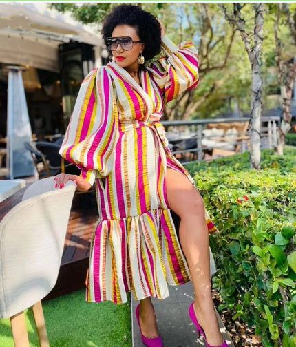 Plus size striped puff sleeve dress with tie belt, V-neck, and tiered skirt