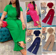 Green round-neck top with wide-leg trousers, matching two-piece twin set