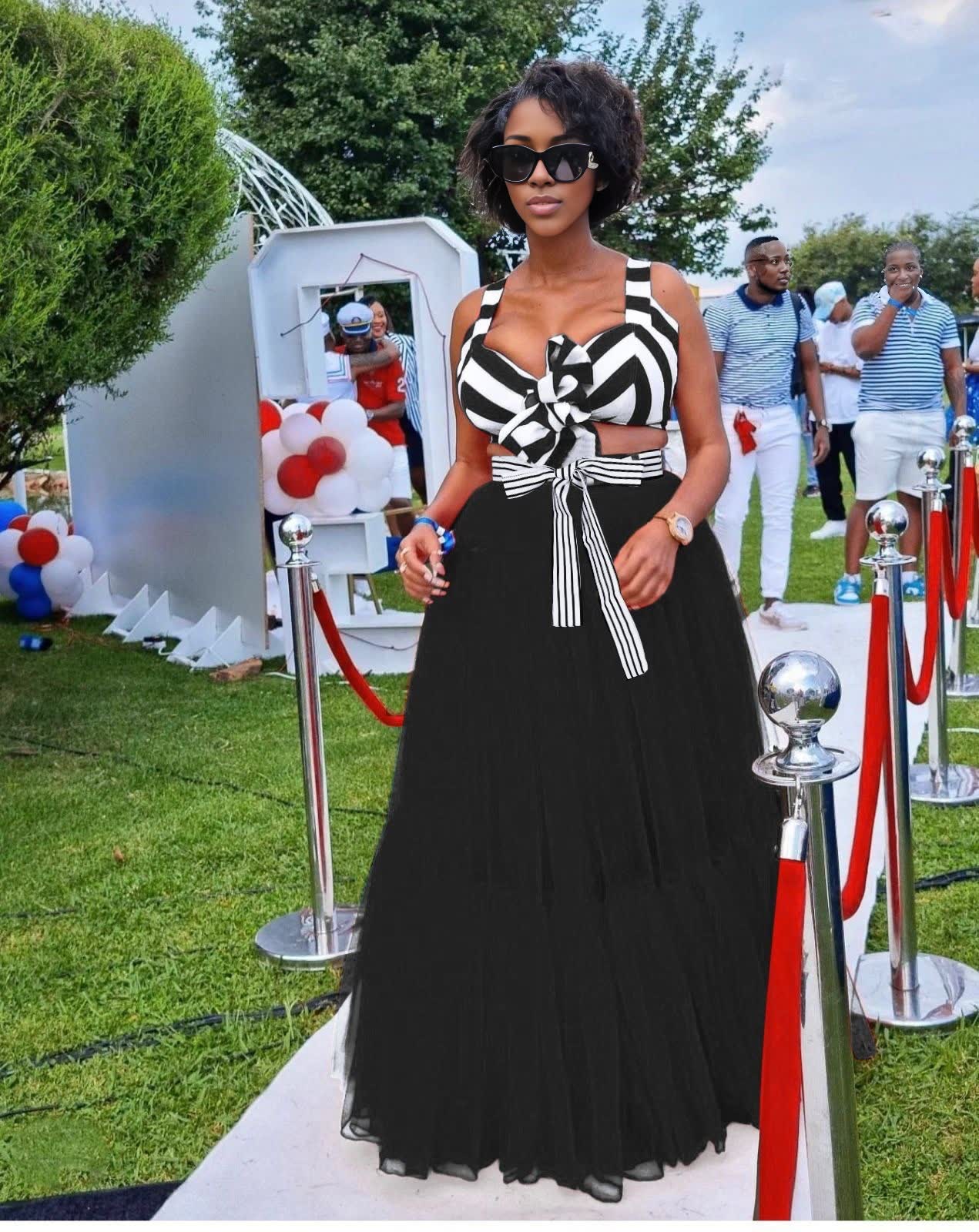 Black maxi skirt outfit with striped bow V-neck top and matching full-length skirt