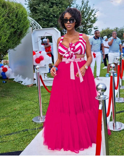Deep-pink maxi skirt outfit with white striped bow V-neck top and full-length skirt