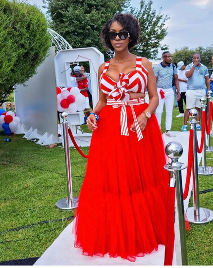 Orange-red maxi skirt outfit with white striped bow V-neck top and full-length skirt