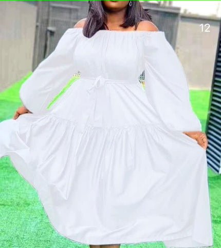 Off-shoulder maxi dress in white with long puff sleeves and ruffle hem