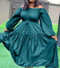 Off-shoulder maxi dress in deep teal with long puff sleeves and ruffle hem