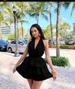 Black halter layered jumpsuit with tiered ruffle waist and deep V neckline