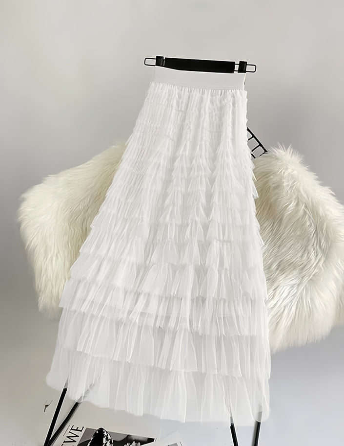 White pleated layered midi skirt with ruffled tiers and tulle-like texture