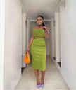 Velvet twin set with green feather-trim crop top and pencil skirt