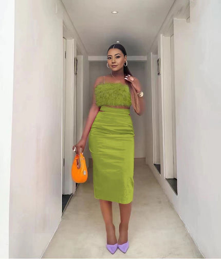 Velvet twin set with green feather-trim crop top and pencil skirt