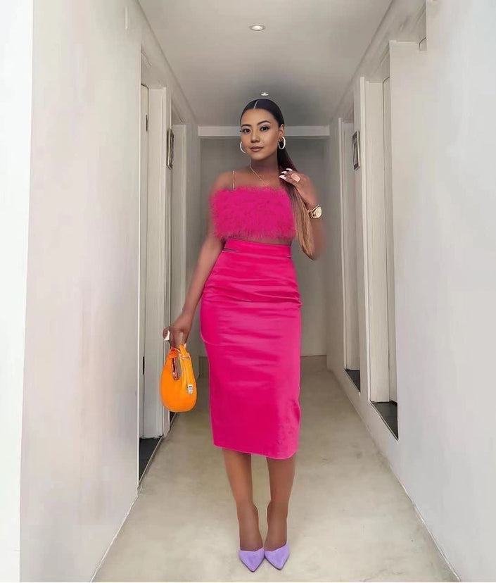 Velvet twin set with pink feather-trim crop top and pencil skirt