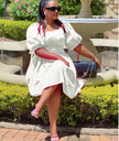 White puff-sleeve A-line dress with ruched bodice and gathered skirt