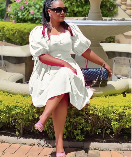 White puff-sleeve A-line dress with ruched bodice and gathered skirt