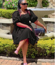 Black puff-sleeve A-line dress with ruched bodice and gathered skirt