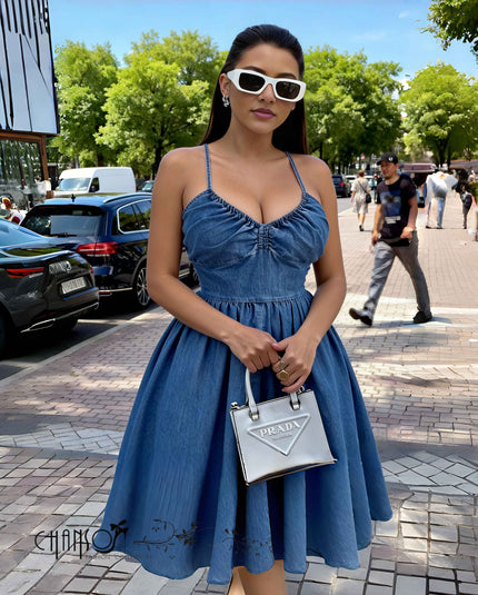 Blue ruched denim maxi dress with spaghetti straps and gathered waist