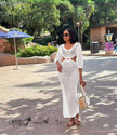 White crochet maxi dress with V neckline and circular back cutout, 3/4 sleeves
