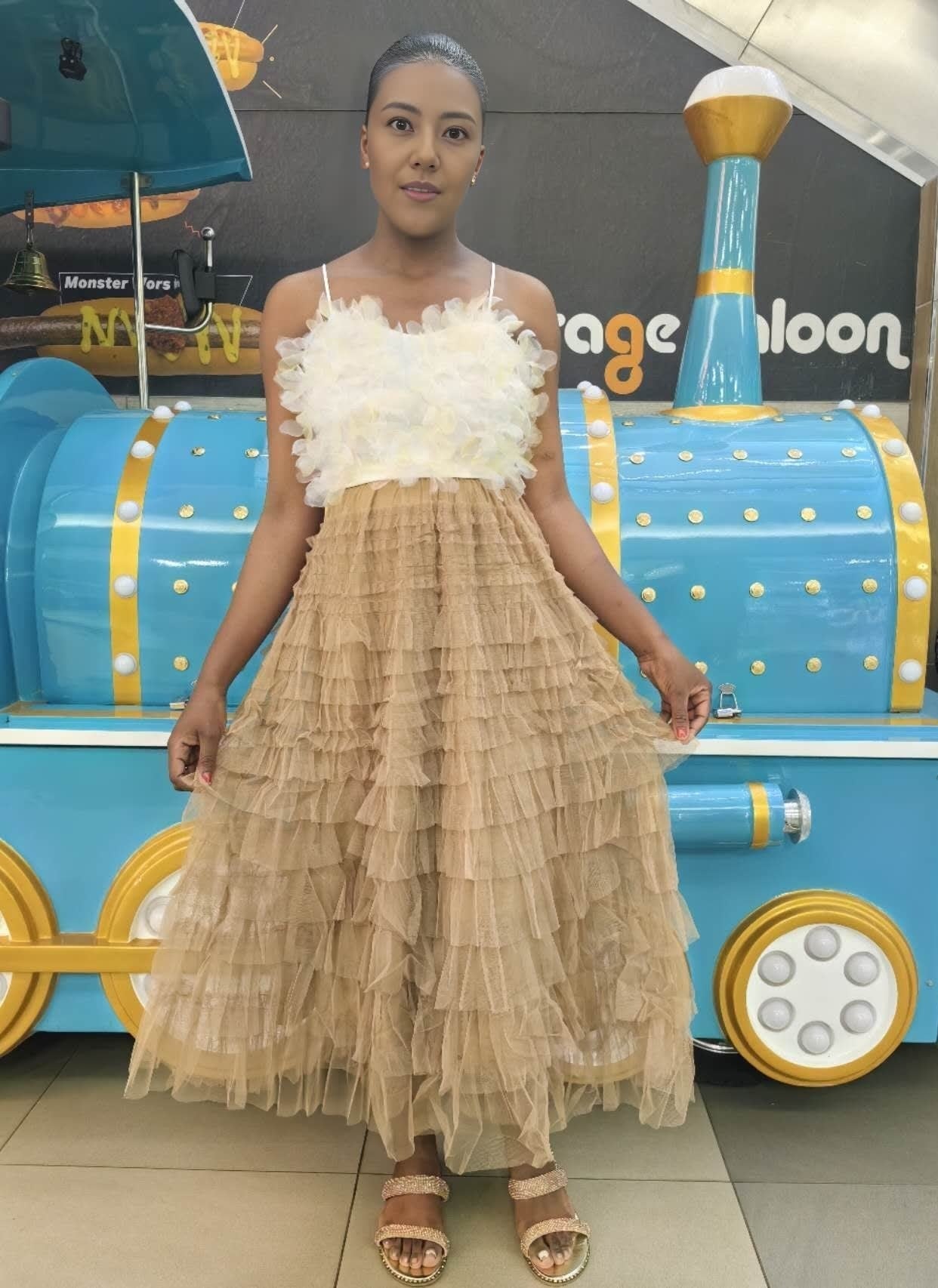 Tan tiered ruffle midi skirt with layered tulle and a gathered skirt hem