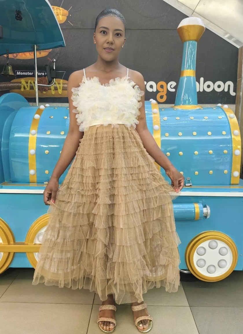 Tan tiered ruffle midi skirt with layered tulle and a gathered skirt hem