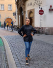 Black long-sleeve pleated blouse with button front and stand collar