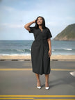 Black midi dress with V-neck, short sleeves, ruched waist knot