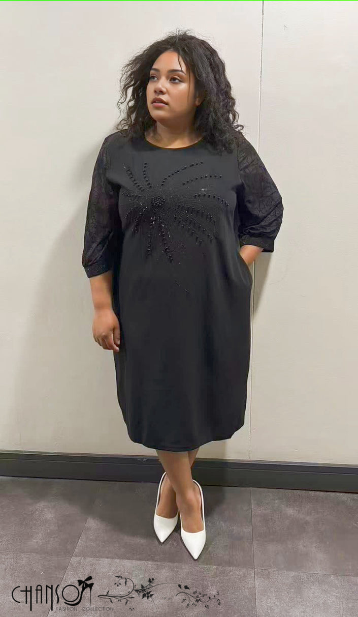 Black midi dress with 3/4 sleeves and beaded floral embellishment on front
