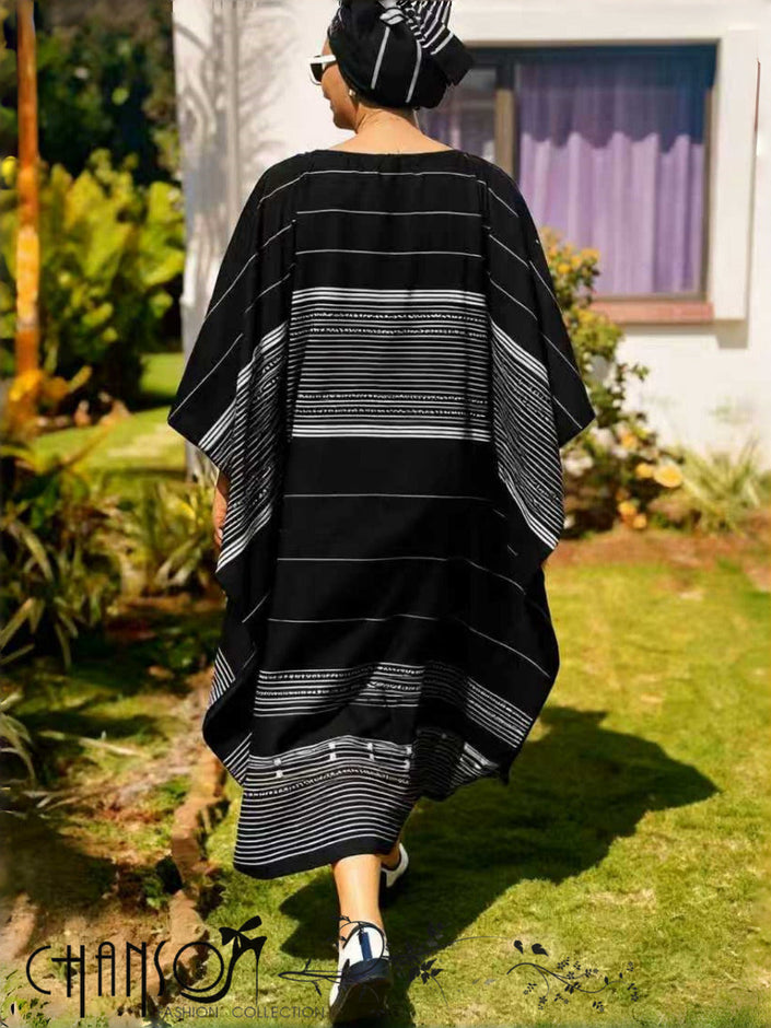 Black striped maxi dress with wide sleeves, back view.