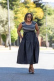 Navy sleeveless midi dress with white horizontal stripes and dark gathered waist skirt