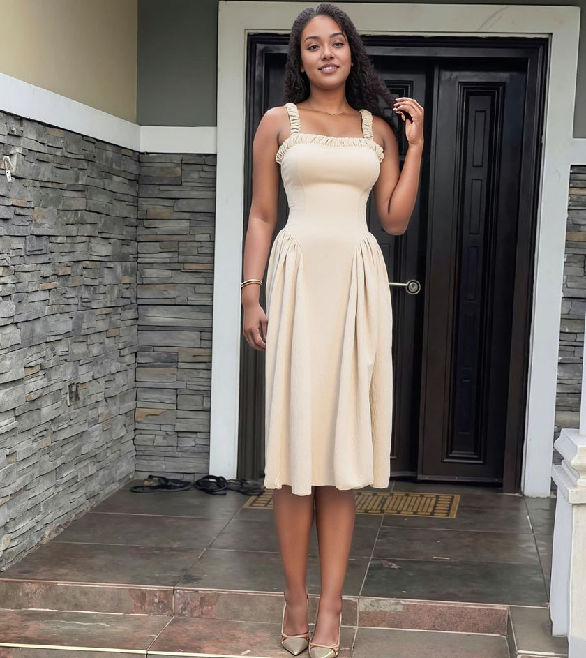 Nude pleated maxi dress with square neckline and gathered straps, flared skirt