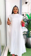White pleated maxi dress with high neck and long flowing skirt
