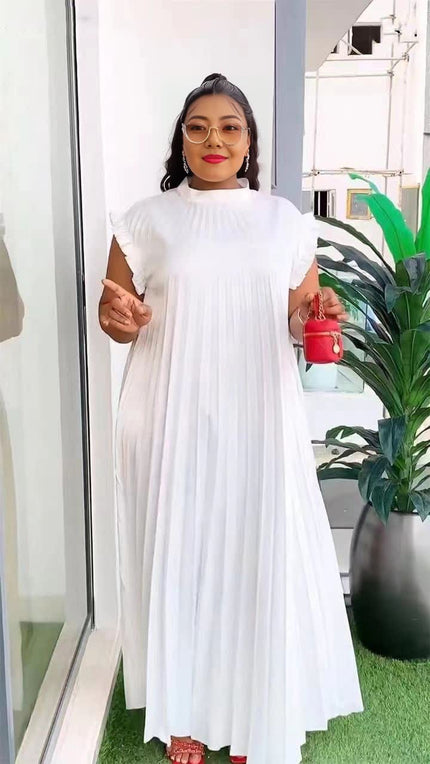 White pleated maxi dress with high neck and long flowing skirt