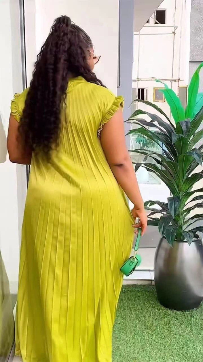 Green-yellow pleated maxi dress with high neck and long flowing skirt