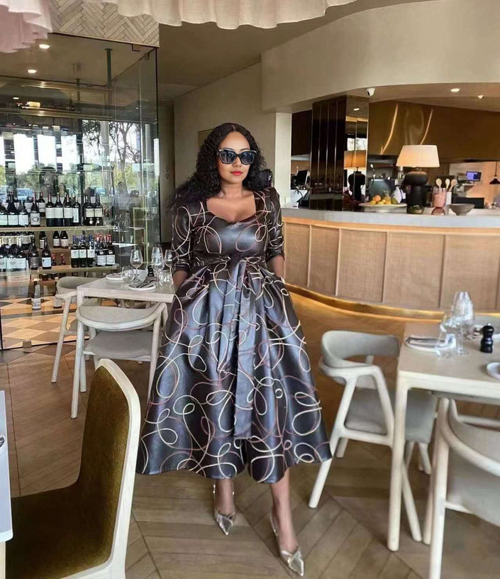 Geometric midi dress with waist tie, long sleeves, off-shoulder square neckline
