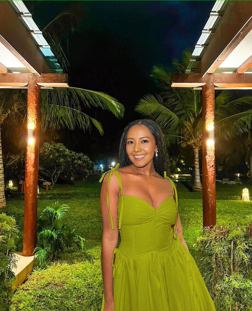 Sleeveless V-Neck Gown with Gathered Waist and Flowing Skirt