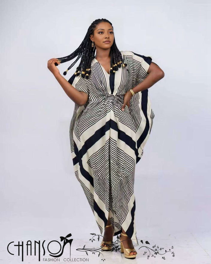 Geometric kaftan dress with V-neck and knot waist, loose draped silhouette, striped navy and cream