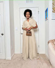 Beige wide-leg jumpsuit with V-neck and adjustable tie waist, short sleeves