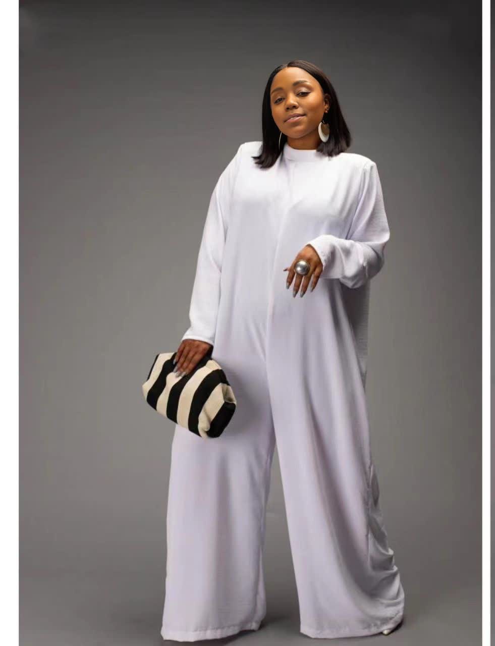 White relaxed-fit jumpsuit with long sleeves, high neckline, wide legs, side pockets