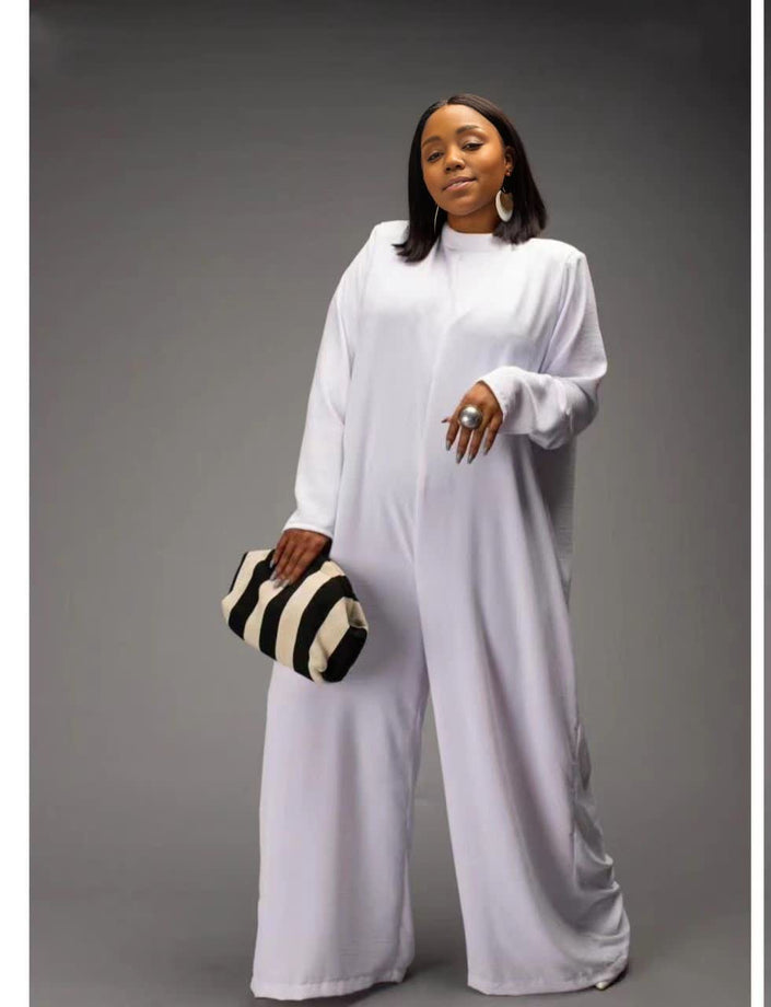White relaxed-fit jumpsuit with long sleeves, high neckline, wide legs, side pockets