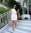 White sleeveless waist-tie twin set with matching shorts, crew neckline