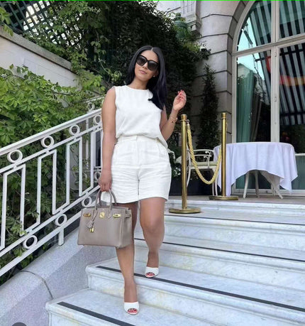 White sleeveless waist-tie twin set with matching shorts, crew neckline