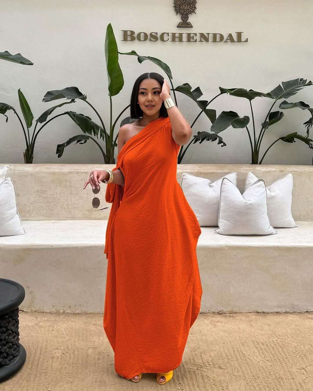 Orange-red one-shoulder maxi dress, layered loose fit, draped side detail