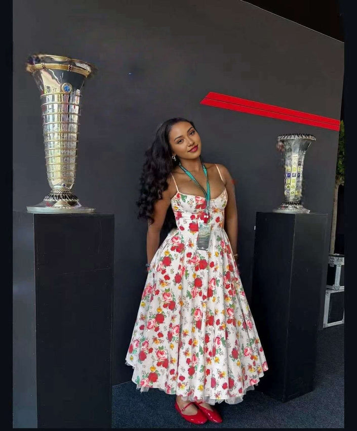 Vintage A-line floral midi dress, white with red flowers, halter straps and fitted bodice.