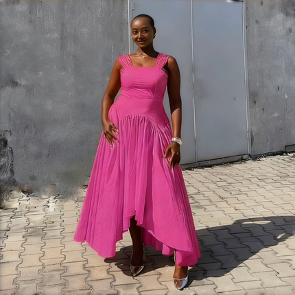 High-low pleated dress in deep pink with square neckline and asymmetrical skirt